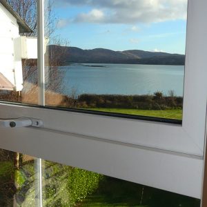 Heron Water Cottage, Bedroom Window. Rent an Irish Holiday Home with Sea View along the Wild Atlantic Way in Kerry, Rent a Cottage with Seaview in Ireland along the Ring of Kerry.