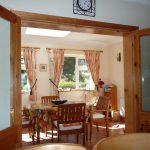 Taobh na Greine, Dining in the Sunroom. Rent an Irish Cottage with Sea View along the Wild Atlantic Way in Kerry from www.fir-darrig.net. Rent a Holiday Home with Seaview in Ireland along the Ring of Kerry.